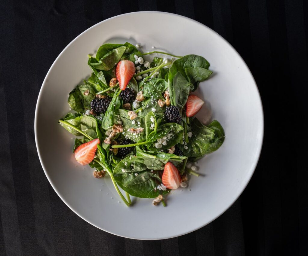 MIND diet for vegetarians plate with leafy greens, berries, beans and walnuts