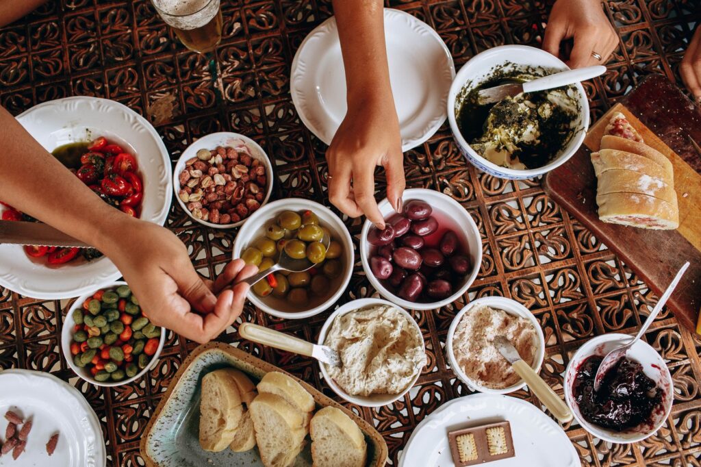 Mediterranean diet foods with olive oil, vegetables and whole grains